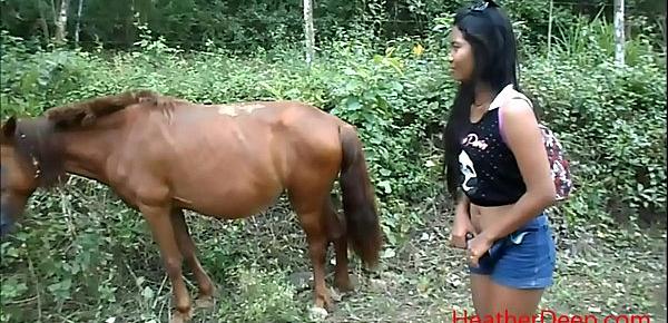  peeing next to horse in jungle